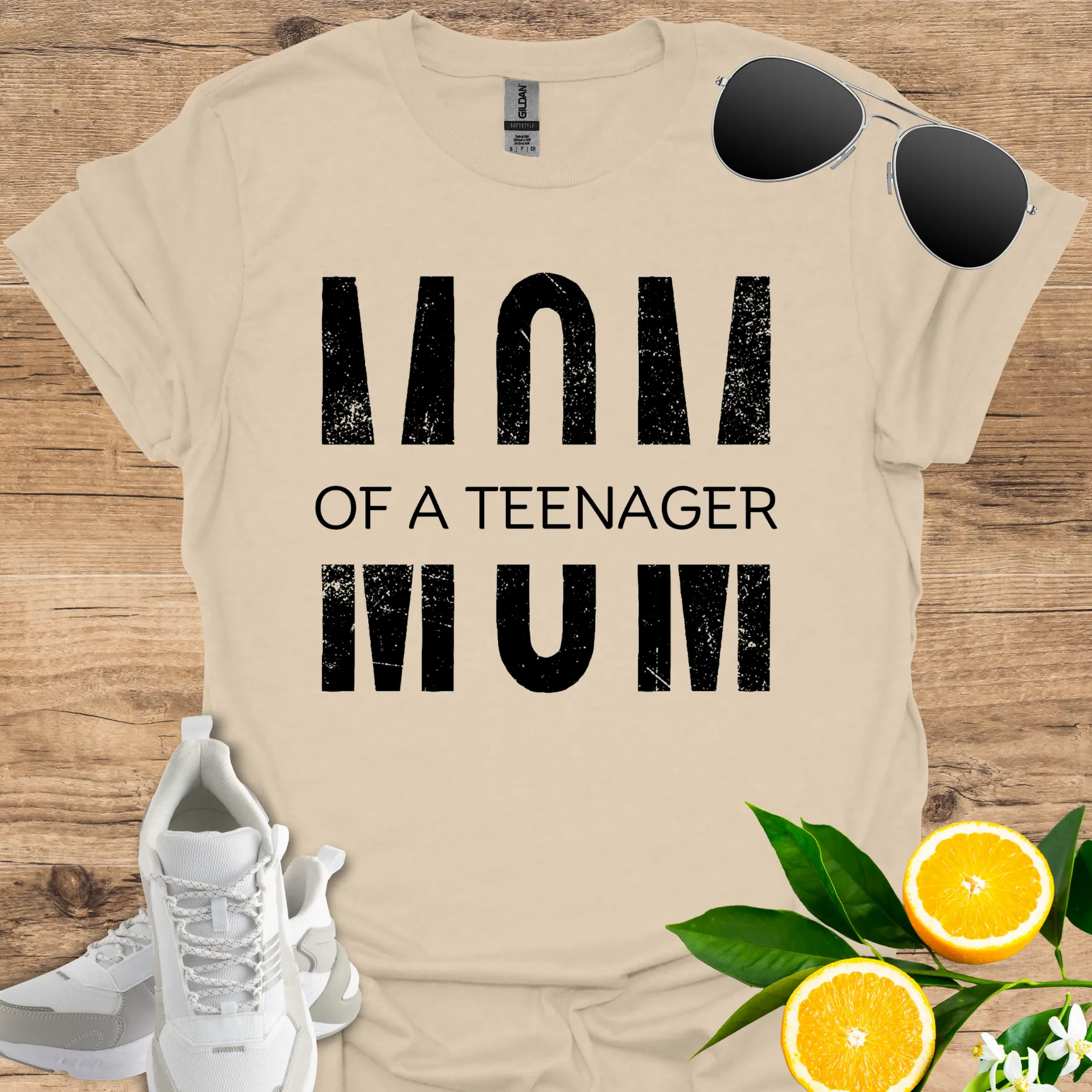 mom of a teenager (cut in the middle design) tee sand